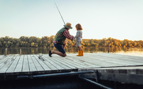 young child and father fishing