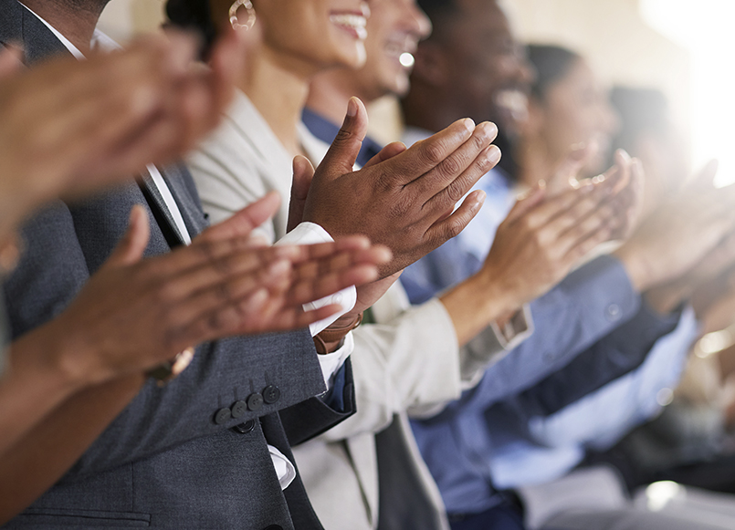 People clapping on a meeting