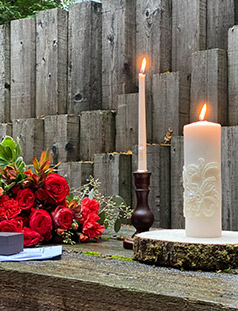 Rustic Wedding Alter decorated with unity candle and red roses