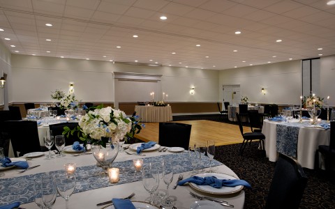 wedding venue with blue and white table settings