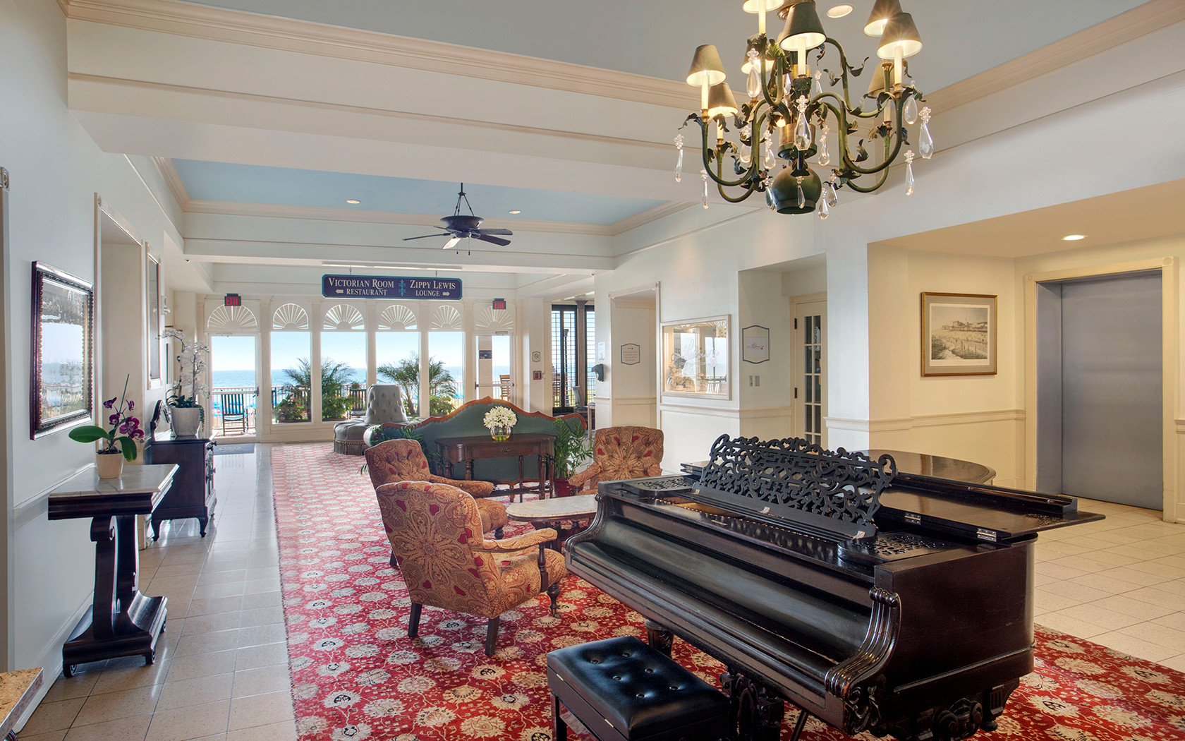 view  of grand piano in entryway room