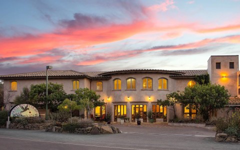 Exterior view of the property at sunset