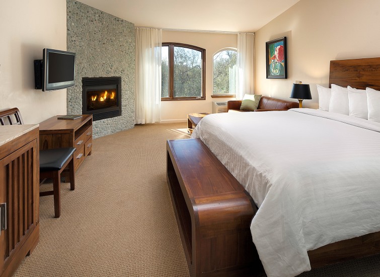 a guest room with an in-room fireplace