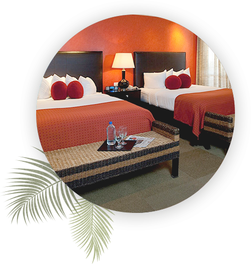 two double beds in a guest room