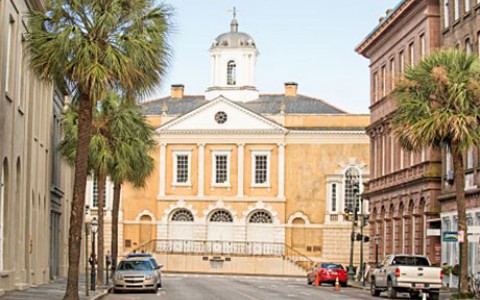 large yellow building at the end of the street