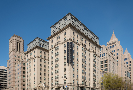 exterior view of hamilton hotel on a sunny day