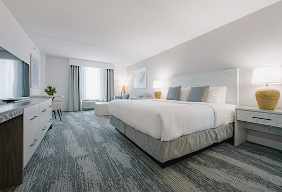 spacious bedroom with a king bed at hotel bethany