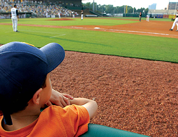 child watching a baseball game