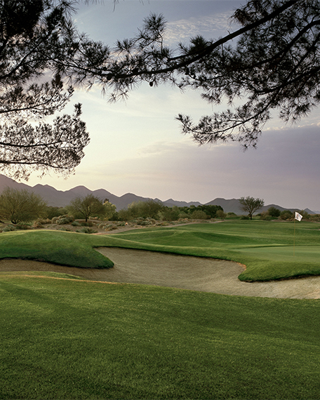Stadium golf course with mountains in the distance