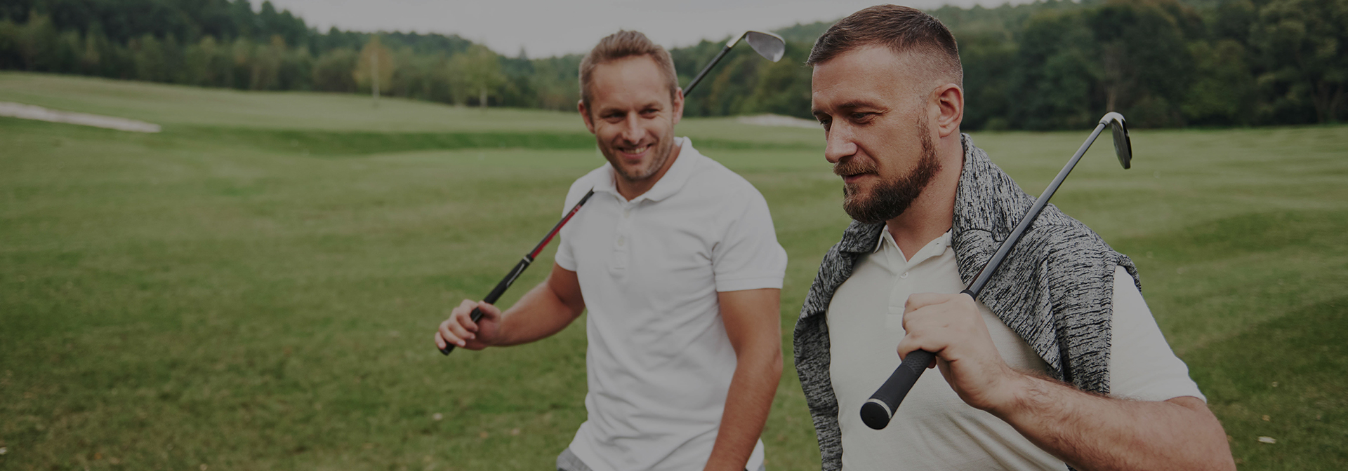 golfer walking on a golf course