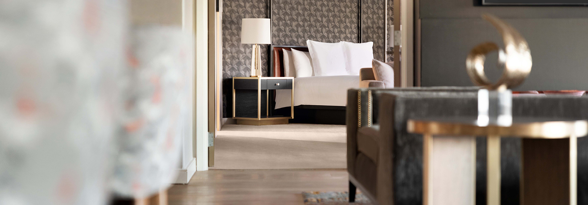 a room with a large bed and couch for relaxing