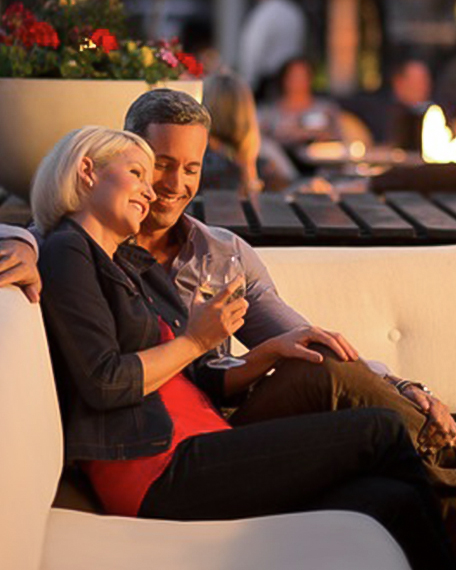 A happy couple drinking wine