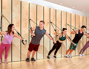 guests working out with exercise cables