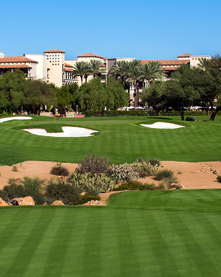 the golf course with the resort in the background