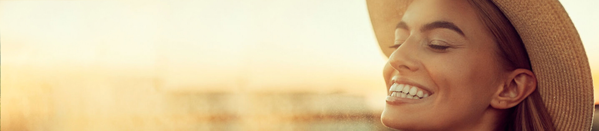 woman smiling in the sunset