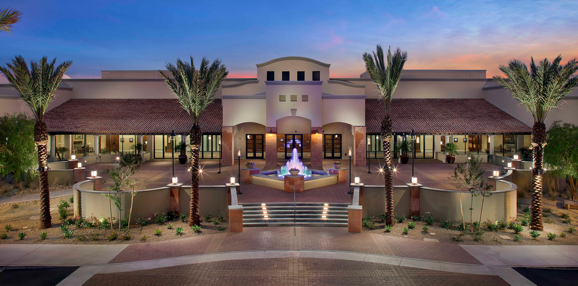view of the front of the resort at sunset