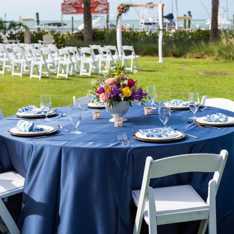 reception table with colorful flowers