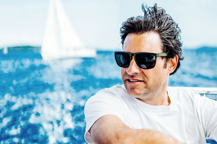 man with sunglasses on the boat