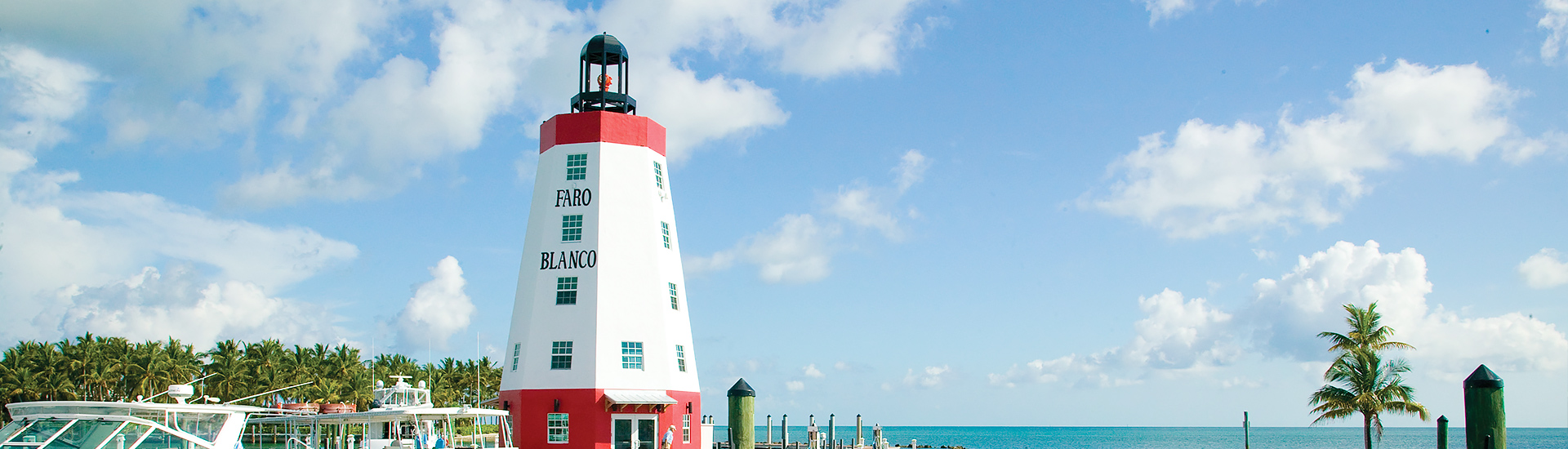 red and white lighthouse daytime