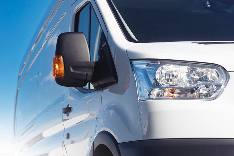 white van with sun glaring in back