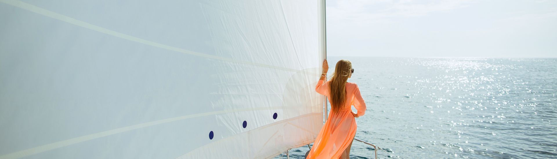 woman in front of sail