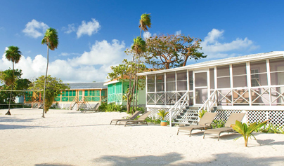 view of teal homes on the sand near the beach