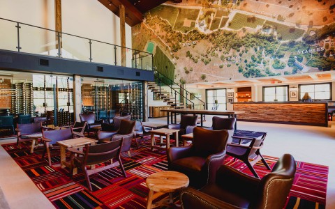seating area with leather chairs and wood tables