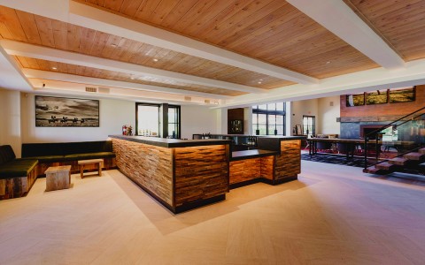 wooden bar in the middle of large room