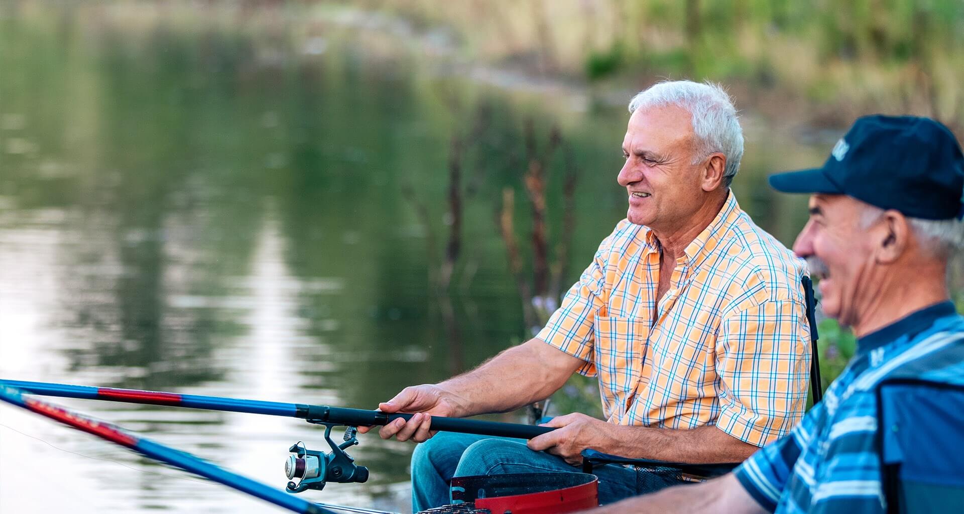 two older men fishing in a boat