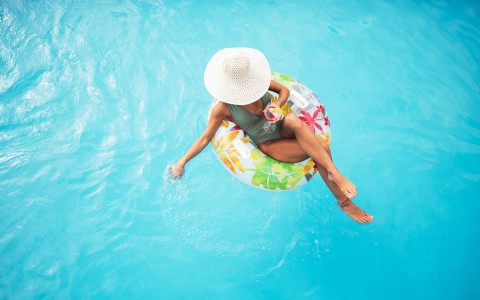 woman on a tube in the pool