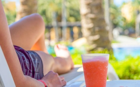 person relaxing with frozen drink