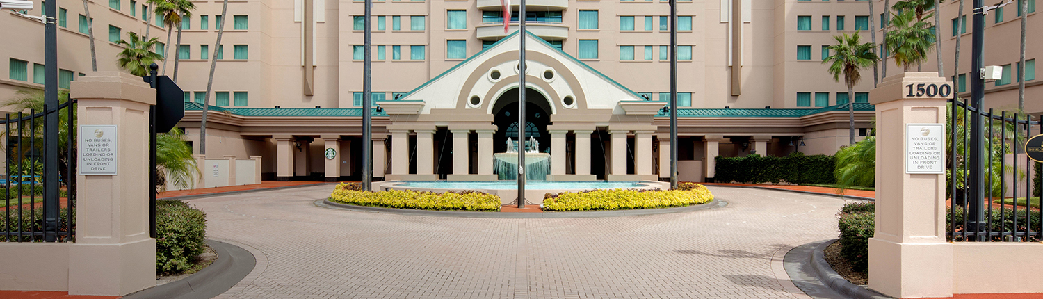 entrance of the hotel with a large fountain in front
