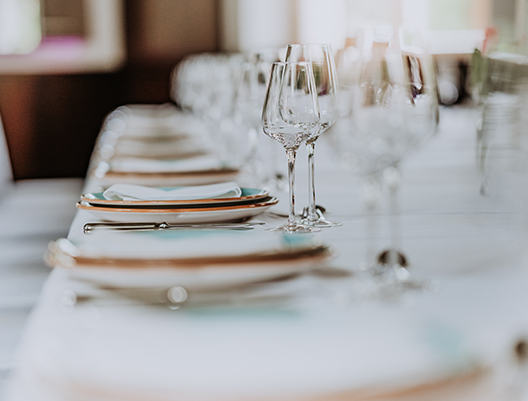 close up shot of plates and glasses for an event