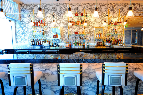 scarpetta bar with shelves filled with bottles of libations