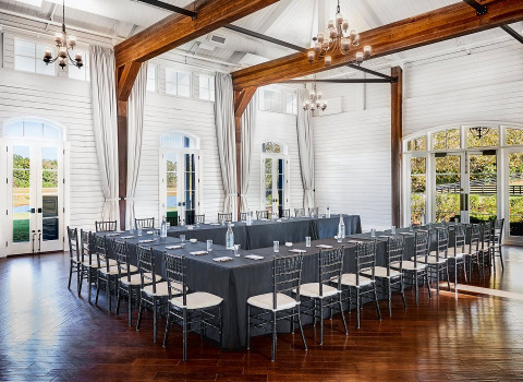 tables and chairs in indoor event space
