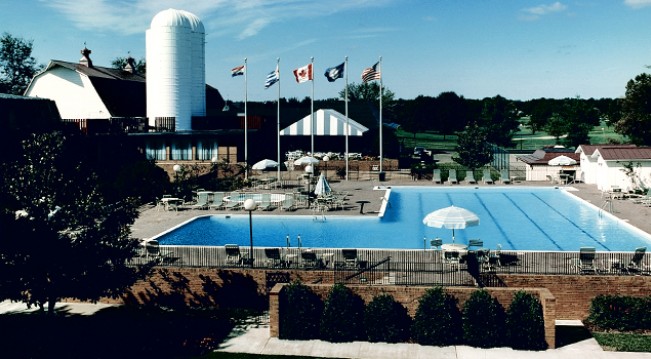 Vintage photo of large pool and flags of different countries
