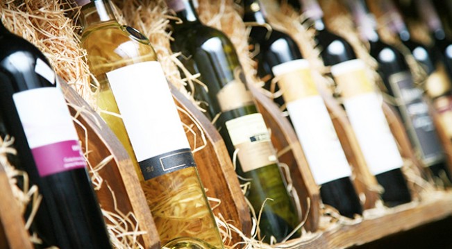 Wine bottle in crates with hay