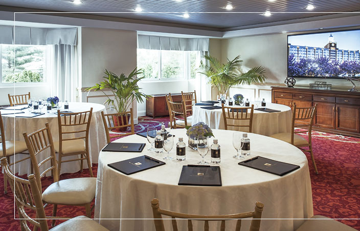 Hubbell suite set up for meeting with round tables