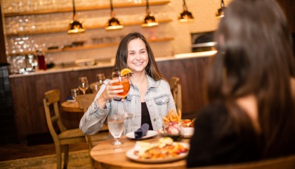 girl holding drink smiling