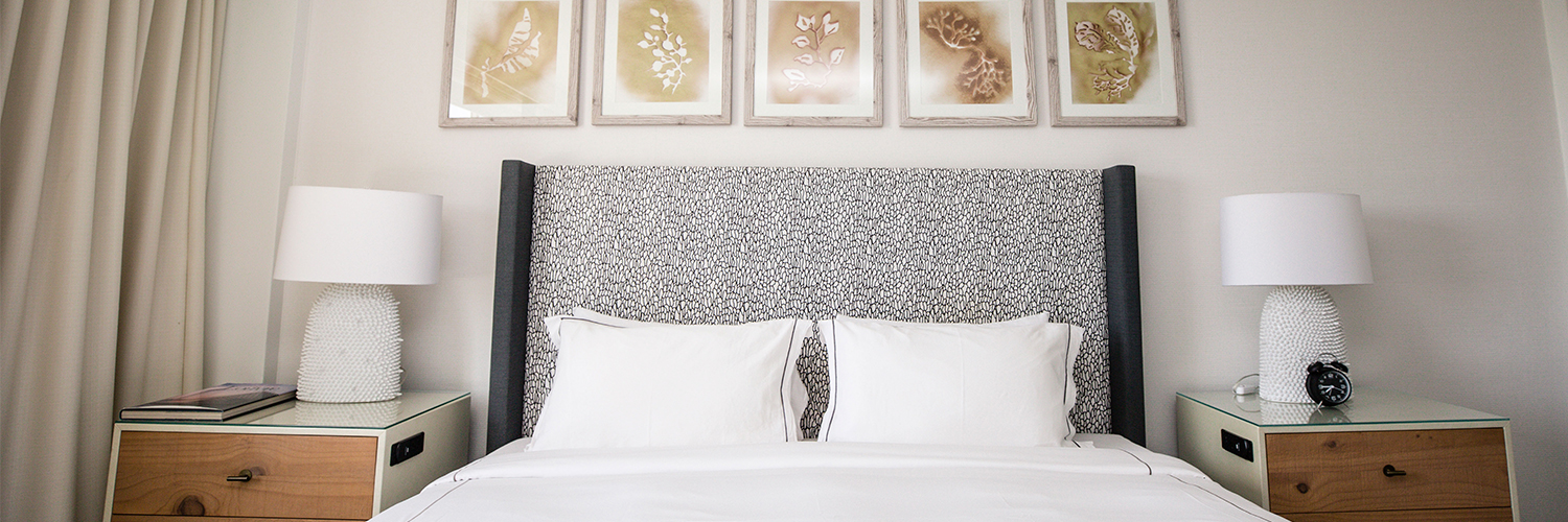 king bed with gray headboard