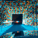 Car driving through a tunnel of Christmas Lights with Snow on the Ground