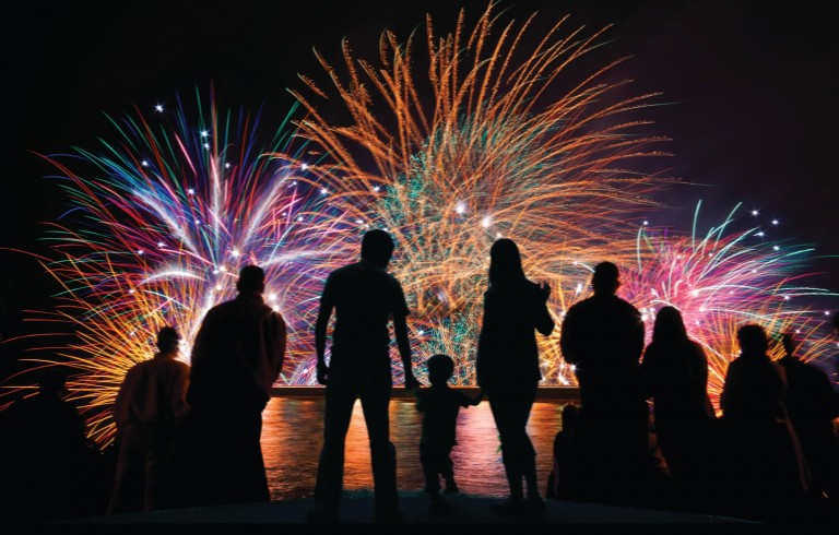 Fireworks with silhouettes of people