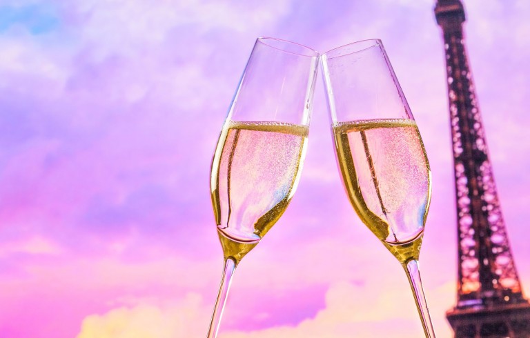 Glasses of champagne with Eiffel tower in the background