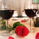 Two glasses of red wine with rose