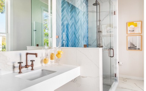 view of a bathroom with blue tile