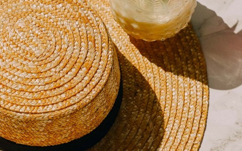 a straw hat and a beverage