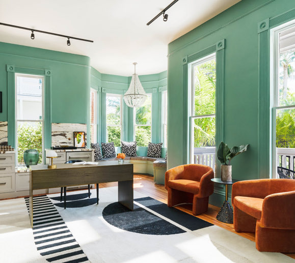 view of seating area with orange velvet chairs