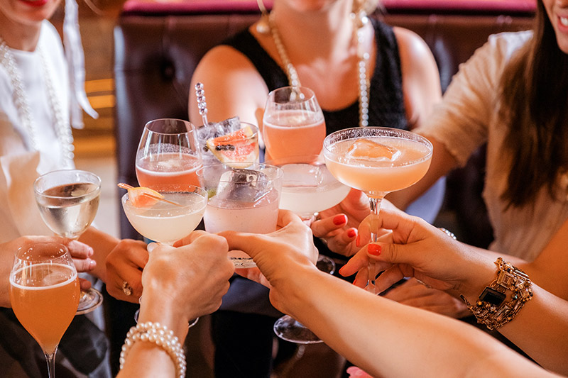a group of people toasting drinks