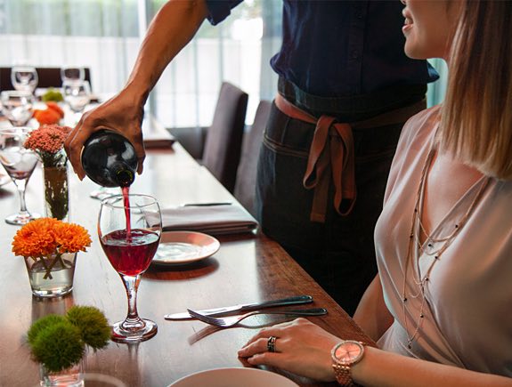 waiter pouring wine