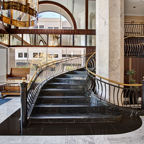 large elegant black staircase with gold accents
